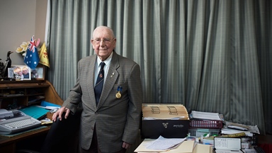 Allan Lorraine standing at desk